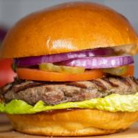 A Kind of Classic · Taste the American dream with our juicy American beef patty cooked medium and served on grid...