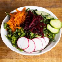 Kale Slaw · Kale, carrots, pickled onions with house made creamy dressing.