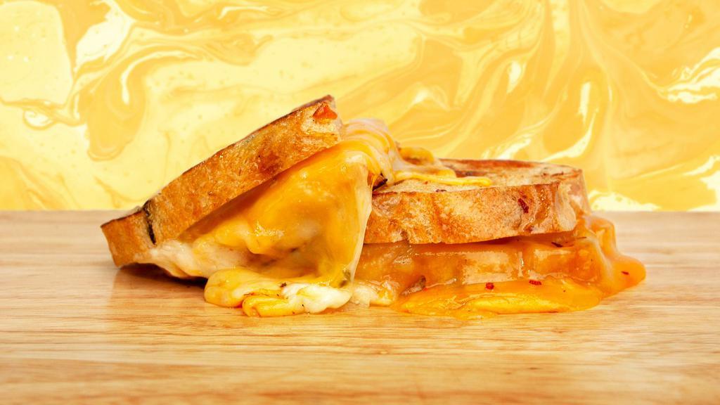 Jalapeno Cheddar Grilled Cheese · Sometimes you just need a kick in the tastebuds. Melty cheddar and pepper jack cheese, spicy jalapenos, and jalapeno spread bet