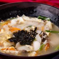 Dduk Man Doo Gook 떡만두국 · Rice cake w/ Pork dumpling soup