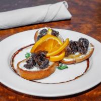 Crostini Fichi · vegetarian.  grilled fig toast, citrus ricotta, rosemary roasted figs, honey drizzle.