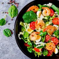 Shrimp Salad · Juicy shrimp salad made with lettuce, artichoke heart, and tomatoes.