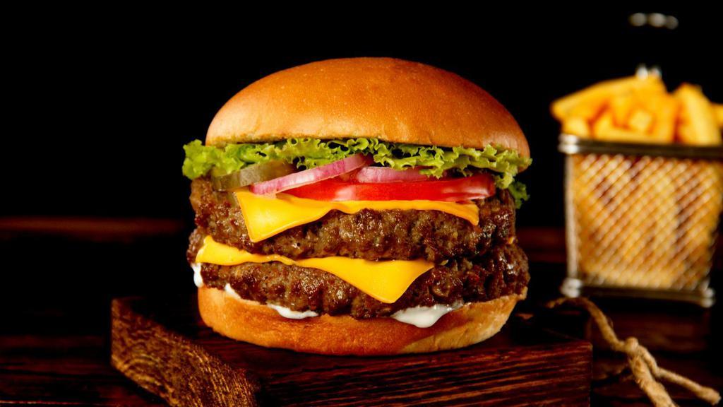 Double Cheese Burger · Mouthwatering juicy double cheeseburger with two 1/3 pound beef patties, mild cheddar cheese, tomatoes, onions, lettuce, mayonnaise, and mustard.