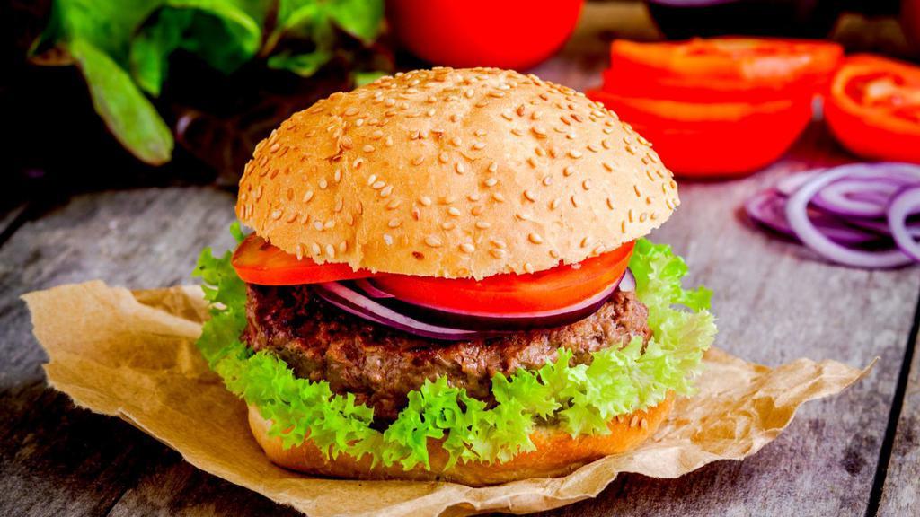 Hamburger · Juicy 1/3 pound beef patty served with tomatoes, onions, lettuce, mayonnaise, and mustard.