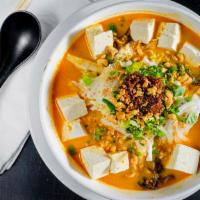 Chili Coconut Peanut Pho · Gluten-free. Soups are topped with cabbage, peanuts, cilantro, and onions. Bean sprouts, bas...