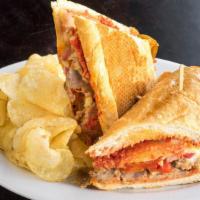 Spicy Italian Sausage Sandwich · Fennel sausage, provolone, mozzarella, spicy cherry peppers, onions, house marinara. Served ...