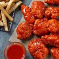 12 Boneless Wings · 12 Boneless Wings tossed in your choice of sauce, served with seasoned fries and your choice...