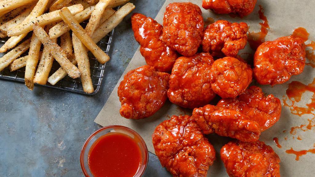 12 Boneless Wings · 12 Boneless Wings tossed in your choice of sauce, served with seasoned fries and your choice of Ranch or Blue Cheese.