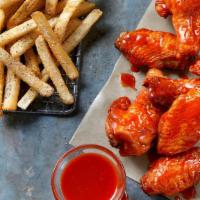 8 Bone-In Wings · 8 Bone-In Wings tossed in your choice of sauce, served with seasoned fries and your choice o...