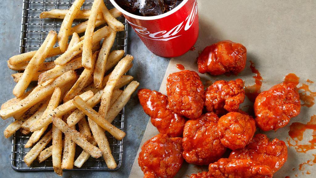 Boneless Wings Combo · 12 Boneless Wings tossed in your choice of sauce,  served with seasoned fries and a Fountain Drink. Includes Ranch or Blue Cheese.