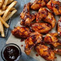 12 Grilled Wings · 12 Seasoned Grilled Wings tossed in your choice of sauce,  served with seasoned fries and yo...