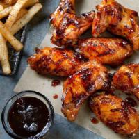 8 Grilled Wings · 8 seasoned Grilled Wings tossed in your choice of sauce, served with seasoned fries and your...