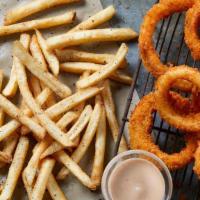 Cellmates · Our Jumbo Cajun-Seasoned Onion Rings and Seasoned Fries. These partners in crime are a notor...