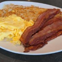 BACON & EGGS · Four strips thick cut bacon, two eggs any style, hash browns, pancakes or toast.