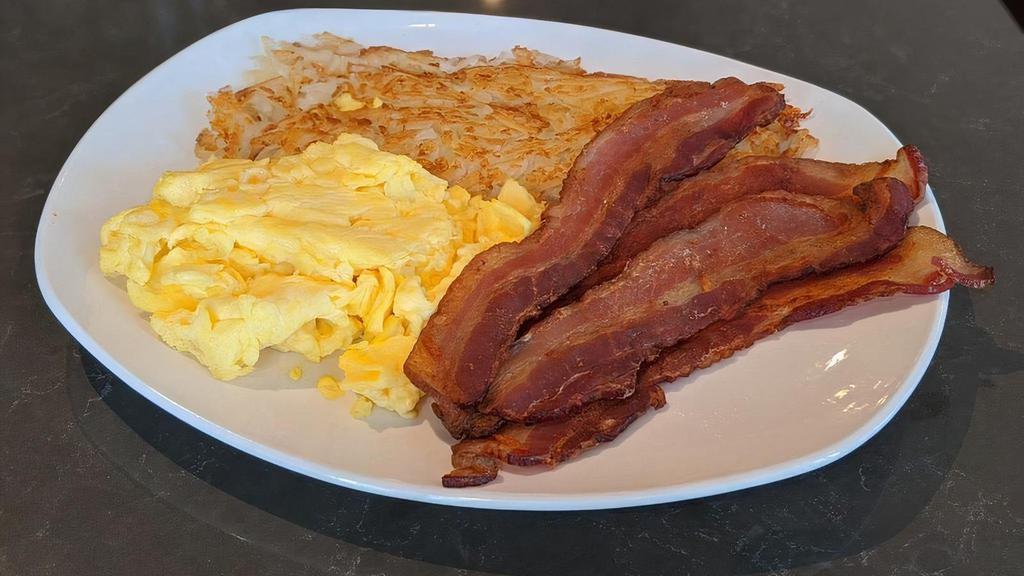 BACON & EGGS · Four strips thick cut bacon, two eggs any style, hash browns, pancakes or toast.