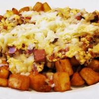 UNCLE JOHN'S SKILLET · Ham, sausage, bacon, onions, jack and white cheddar, scramble eggs, country potatoes, pancak...
