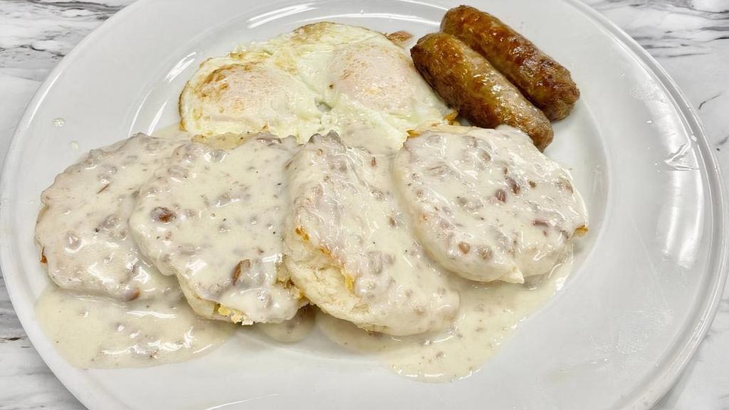 BISCUITS & GRAVY DELUXE · Buttermilk biscuits, house-made country gravy, two eggs any style, two strips bacon.