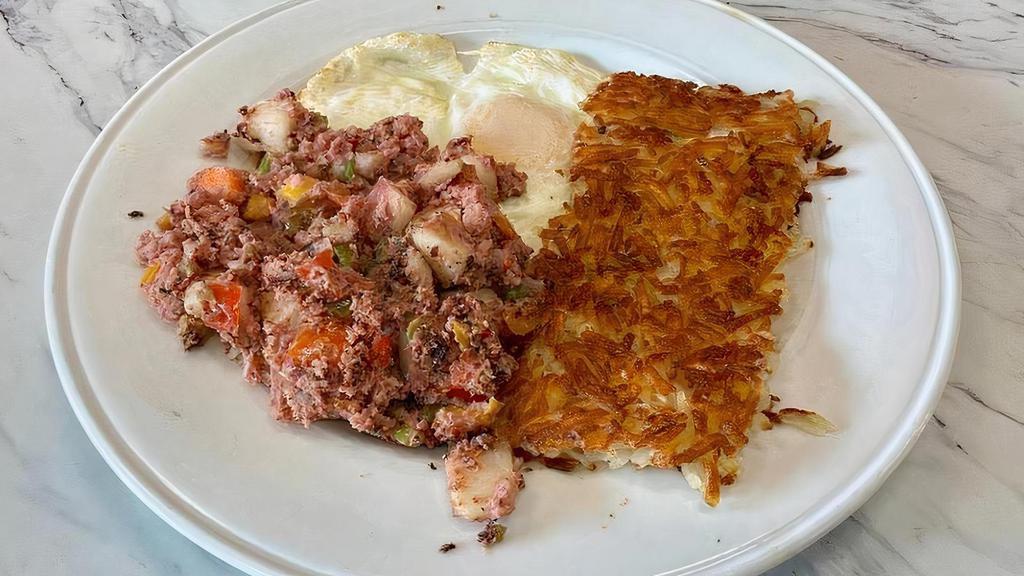 CORNED BEEF HASH · From scratch! Tender corned beef brisket, diced potatoes, bell peppers, onions, two eggs any style, hash browns, pancakes or toast.