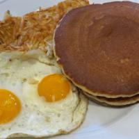 TWO EGG BREAKFAST · 2 eggs any-style, hash browns, and your choice of pancakes or toast