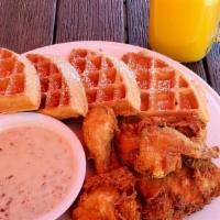 FRIED CHICKEN & WAFFLE · Belgian waffle, powdered sugar, jumbo chicken wings, house-made country gravy, butter and sy...