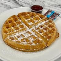 BELGIAN WAFFLE · Belgian waffle, powdered sugar, butter and syrup.