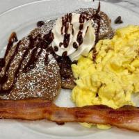 KIDS CHOCOLATE PANCAKES · Six mini chocolate pancakes, one strip bacon, one egg