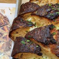 WHOLE-LOAF CHEESY GARLIC BREAD · unbaked country loaf stuffed with herbed garlic butter and peppered monterey jack cheese; wi...