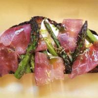 ASPARAGUS & JAMON TARTINE · Koji-brined asparagus, whipped ricotta, jamon serrano, green garlic oil