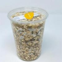 MUESLI · 20 oz. organic rolled and toasted oats, sesame, flaxseed, chia seed, coconut, almonds, golde...