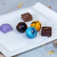Individual Chocolates (Assorted Flavors) · Colorful enrobed, sphere, and square chocolates.