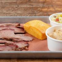 Sliced Brisket · limited supply. Sliced smoked brisket tender, with two sides and cornbread.