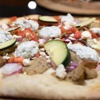 Beef & Lamb Gyro Pizza · White pizza sauce, marinated lamb beef gyro meat, tomatoes, cucumbers, feta cheese and drizz...