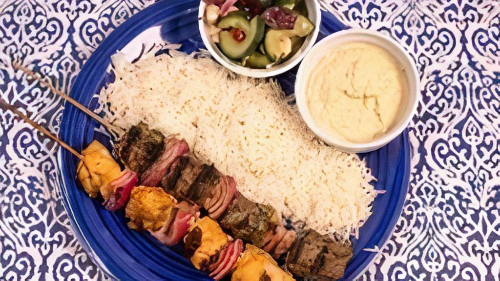 Chicken Kabob 2 Skewer Meal · Served with basmati rice, Greek salad and a side of hummus.