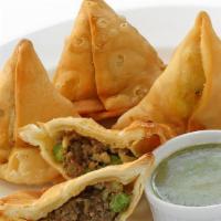 Meat Samosa · Pastry with ground lamb and peas
