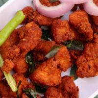 Chicken Pakora · Pieces of chicken dipped in chick pea batter and deep fried.
