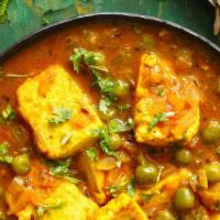 Matar Paneer · Green peas cooked lightly with homemade cheese