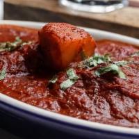 Lamb Vindaloo · Lamb cooked with spicy sauce and potatoes