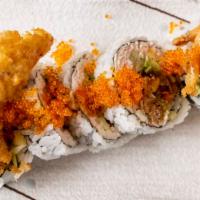 Spider Roll · Soft shell crab, avocado and crab cucumber with unagi sauce and tobiko.