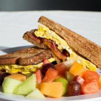 Toast Breakfast Sandwich · Choice of toast with two eggs, cheese and choice of meat.Choice of bacon, ham or sausage