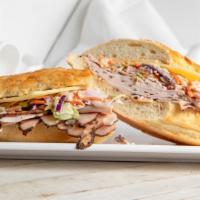 Pastarami Turkey Reuben · Pastrami seasoned turkey and gold label imported Swiss cheese with coleslaw and thousand isl...