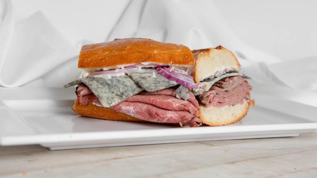 The London Broil · London broil roast beef and Bold Marbleu Moneterey Jack Cheese with red onion and mayonnaise.