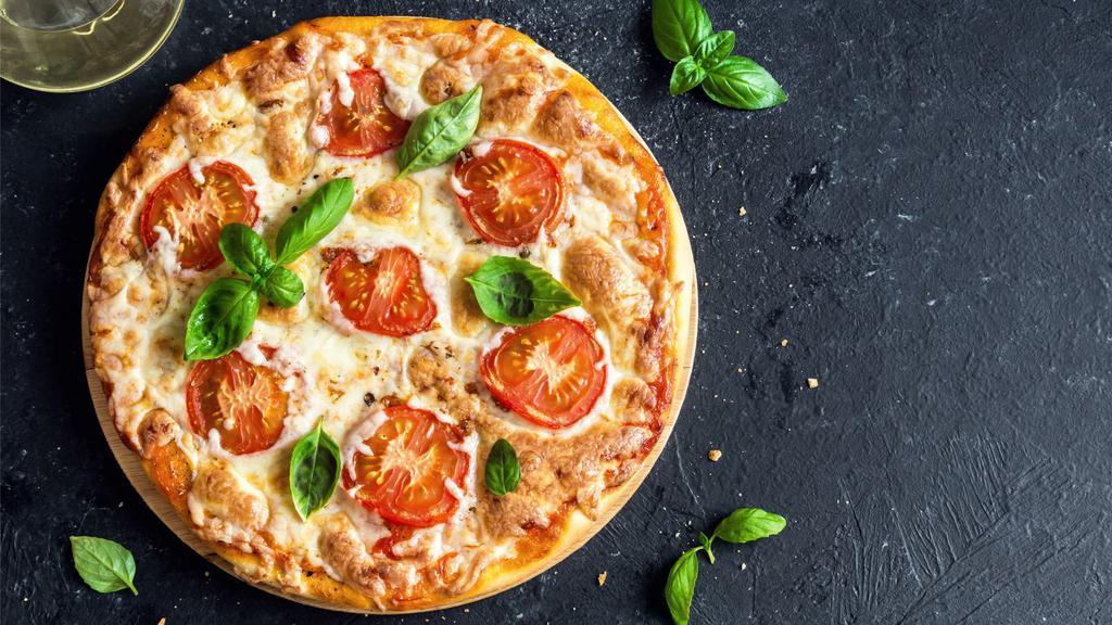 10'' Margherita Pizza · Choice of Your Dough, Marinara, Fresh Mozzarella, Roasted Tomatoes, Olive Oil, Topped with Fresh Basil.