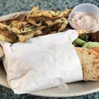 Falafel Pita Wrap(Vegetarian) · delicious falafel fried until crispy, wrapped in a warm pita with spring greens, cucumber, a...