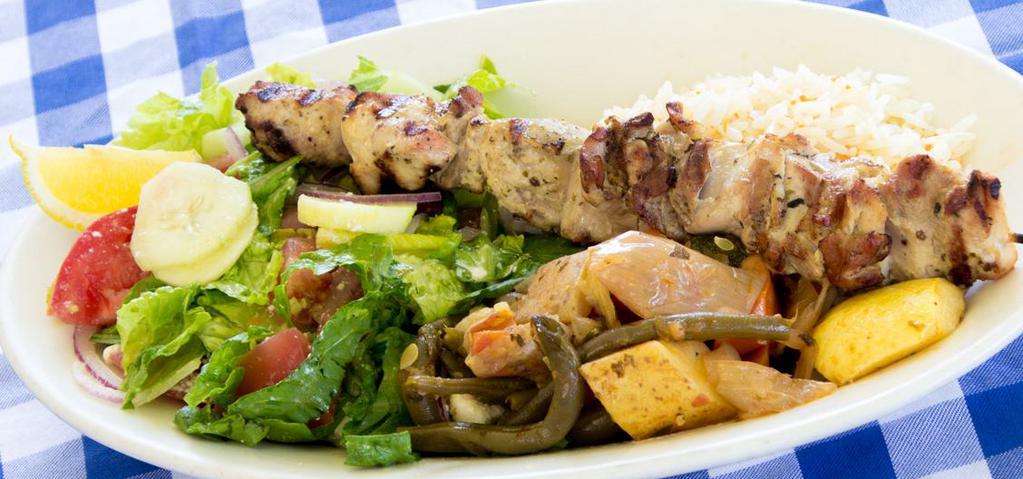 Chicken Souvlaki Plate · Tender pieces of marinated halal chicken thigh grilled on a skewer, served with rice and vegetable medley