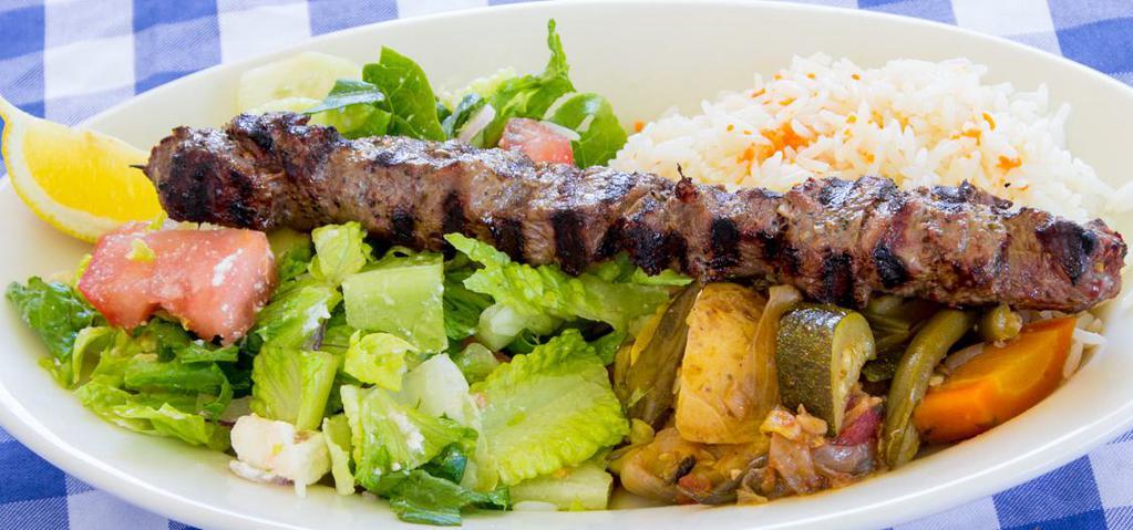 Lamb Souvlaki Plate · Tender pieces of marinated lamb loin grilled on a skewer, served with rice and vegetable medley