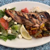 Salmon · Marinated Atlantic salmon filet grilled and served over rice with vegetable medley