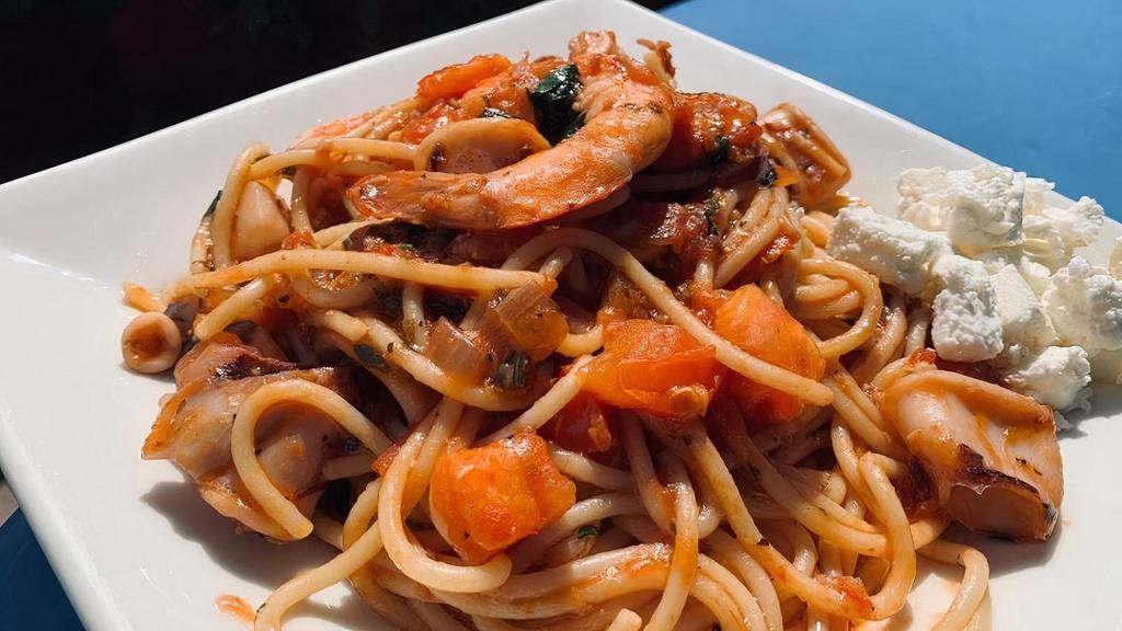 Seafood Pasta · this delicious new special features the best of summer's ocean catch. large tiger prawns, scallops, and fresh squid added to our house made tomato sauce  on a bed of spaghetti makes this dish a real treat. served with our house athena salad. enjoy!
