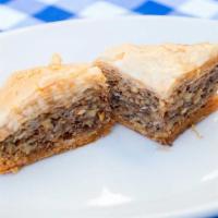 Baklava · traditional greek dessert made from scratch in house; phylo dough filled with walnuts and to...