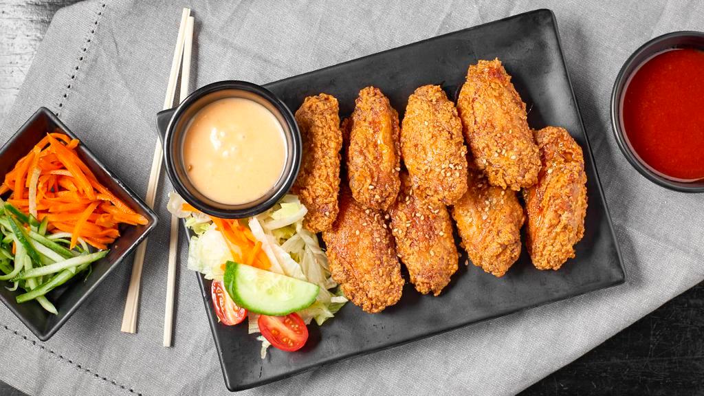 Wings (8pcs) · Chicken wings with a choice of flavor and one side.