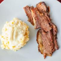 Mac Brisket · A single serving of our signature Mac & Cheese topped with our juicy and delicious brisket.